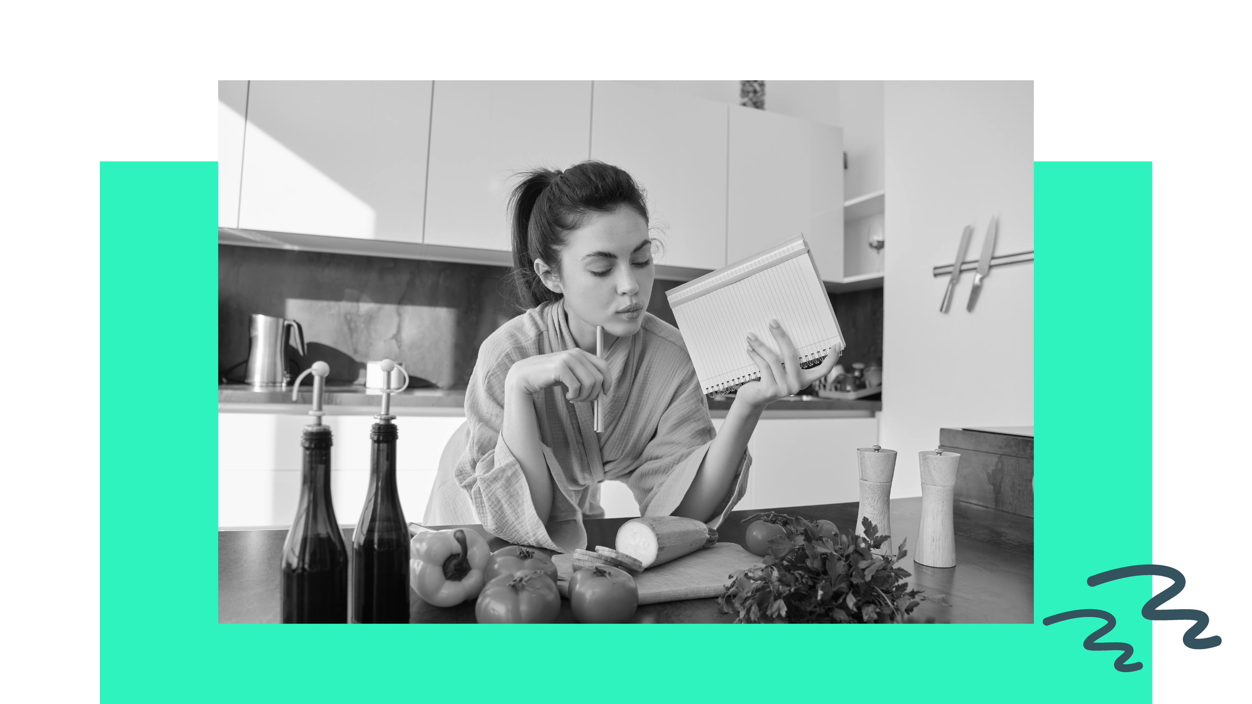A woman works on writing a recipe in her kitchen for her meal prep side hustle